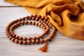 gurus sandalwood necklace on a plain cloth Royalty Free Stock Photo
