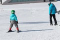 Gusar - Azerbaijan: January 2019. Little boy learning skiing with his father during winter holidays in Shahdag Mountain