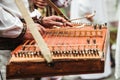 Gusli is an ancient traditional russian musical instrument. Gusli folk musical instrument in men`s hands close-up