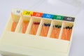 gutta-percha pins in a set of different sizes for root canal filling, endodontic ruler close-up Royalty Free Stock Photo