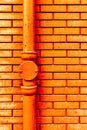 Gutter downpipe and brick wall Royalty Free Stock Photo