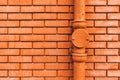 Gutter downpipe and brick wall Royalty Free Stock Photo
