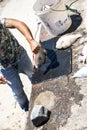 Gutting a fish in Camara de Lobos a fishing village near the city of Funchal and has some of the highest cliffs in the world