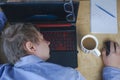 Tired of hard work student guy sleeping on laptop at table Royalty Free Stock Photo