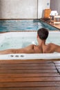 Guy back inside a jacuzzi Royalty Free Stock Photo