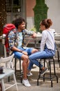 Guy with backpack talking with girl