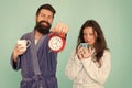 Guy in bath clothes hold tea coffee. Breakfast concept. Every morning begins with coffee. Couple in bathrobes with mugs