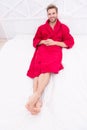 Guy in bathrobe relaxing. Maintaining consistent circadian rhythm essential for general health. Man handsome guy