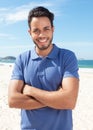 Guy with beard and blue shirt standing at beach Royalty Free Stock Photo