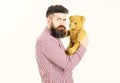 Guy with beard does not like to share soft toy.