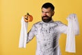 Guy with beard holds orange pumpkin with smile Royalty Free Stock Photo