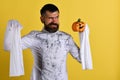 Guy with beard holds orange pumpkin with smile Royalty Free Stock Photo