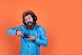 Guy with beard playing video games. brutal caucasian hipster with moustache. relax at home. console controller joystick Royalty Free Stock Photo