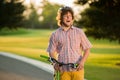 Guy with bicycle having fun outdoors.