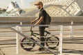 Guy with a bicycle riding around town. Bike bmx