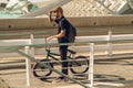 Guy with a bicycle riding around town. Bike bmx