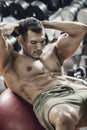 Guy bodybuilder in gym Royalty Free Stock Photo