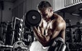 Guy bodybuilder with dumbbell Royalty Free Stock Photo