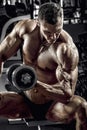 Guy bodybuilder with dumbbell Royalty Free Stock Photo