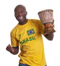 Guy from Brazil with drum is happy about his team