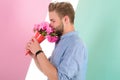 Guy bring romantic pleasant gift waiting for her. Man ready for date bring pink flowers. Boyfriend confident holds Royalty Free Stock Photo