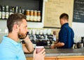 Guy busy speak phone while relax coffee break. Ready to hear you. Man holds cup of drink while have mobile conversation