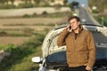 Guy calling roadside assistance for his breakdown car Royalty Free Stock Photo