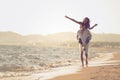 A guy carrying a girl on his back, at the beach, outdoors Royalty Free Stock Photo