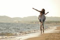 A guy carrying a girl on his back, at the beach, outdoors Royalty Free Stock Photo