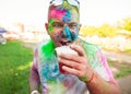 Guy celebrate holi festival, make selfie