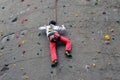 Guy climbing a public rock wall in Berlin