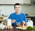 Guy cooking scrambled eggs Royalty Free Stock Photo