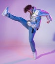 Cool guy dancing contemporary dance in studio. Neon light background. Acrobatic bboy dancer. Break dance lessons. Royalty Free Stock Photo