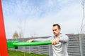 A guy is doing outdoors bar body weight workout Royalty Free Stock Photo