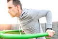 A guy is doing outdoors bar body weight workout Royalty Free Stock Photo