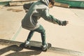 Guy doing skateboarding tricks at the skatepark Royalty Free Stock Photo