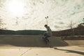 Guy doing skateboarding tricks at the skatepark Royalty Free Stock Photo