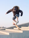 Guy doing a stunt with his skateboard