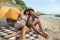 Guy embracing his pleased girl on sandy sea beach Royalty Free Stock Photo