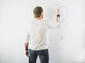 Guy erasing a question mark on a white wall Royalty Free Stock Photo