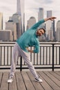 Guy exercise in NYC. Athletic Mature Fit Man Doing Exercises in City outdoor. Happy man workout in New York city