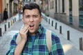 Guy experimenting intense toothache outdoors Royalty Free Stock Photo