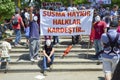 Guy Fawkes masked demonstrators with placards seen in Gezi Park. Royalty Free Stock Photo