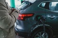 the guy filling up his car and paying for gas on his phone Royalty Free Stock Photo