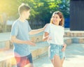 Guy flirts with girl on city street Royalty Free Stock Photo