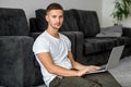 Guy freelancer with laptop working at home