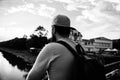 Guy in front of blue sky at evening time admire landscape. Enjoy pleasant moment. Man in cap enjoy sunset while stand on Royalty Free Stock Photo