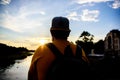 Guy in front of blue sky at evening time admire landscape. Enjoy pleasant moment. Take moment to admire sunset nature Royalty Free Stock Photo