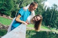 A guy and a girl are walking in the park