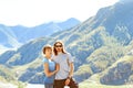 Guy with a girl on the background of mountains Royalty Free Stock Photo